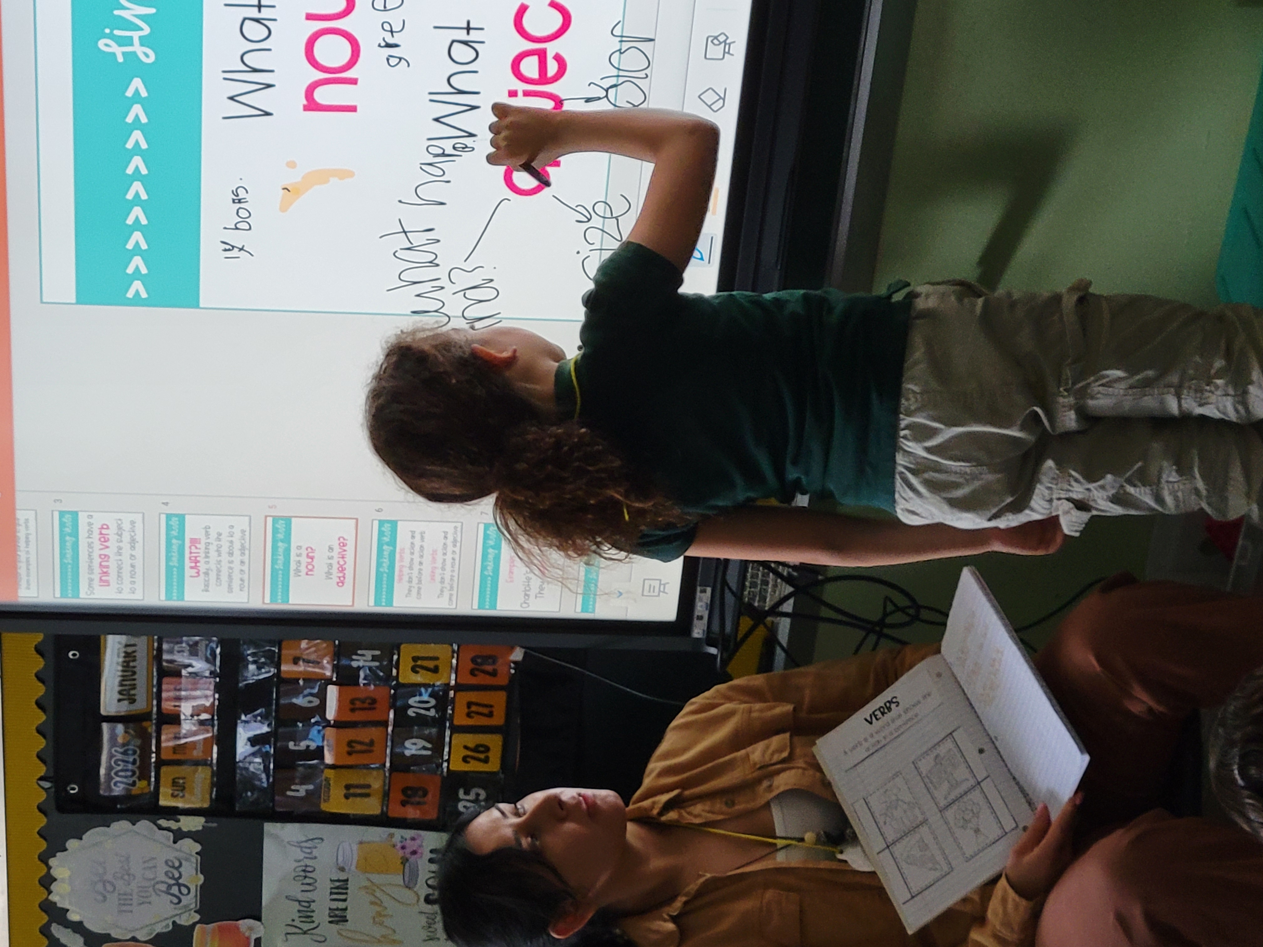 3rd grade interactive panel 3rd grade student writing on interactive panel during ELA lesson